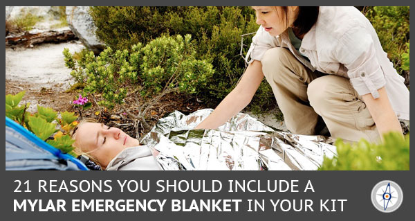 woman covering another woman with a mylar blanket