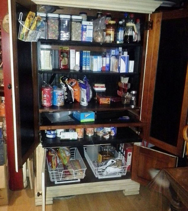 Opened armoire with food supply inside