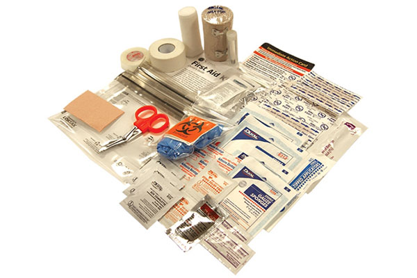 First aid kit with gloves, scissors, bandages, tape, and gauze