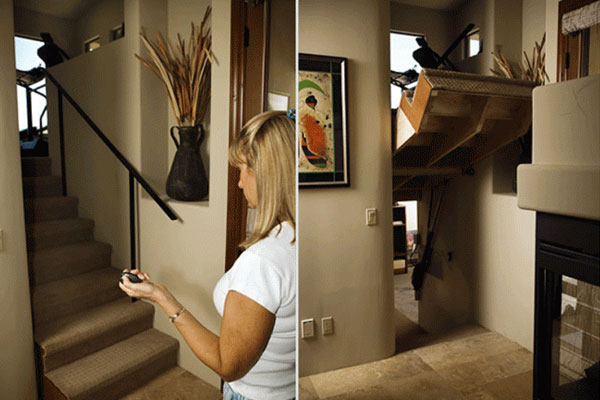Woman holding remote lifts staircase to show hidden room