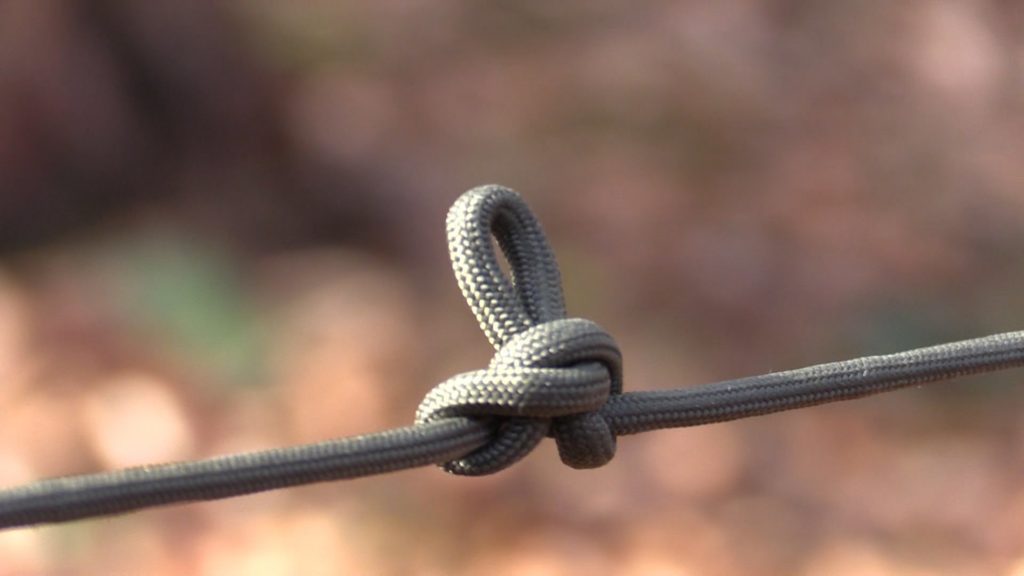 Rope with knot tied in the middle of it