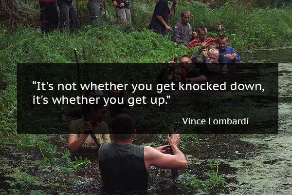 Group of people walking through swampy water with mindset quote from Vince Lombardi