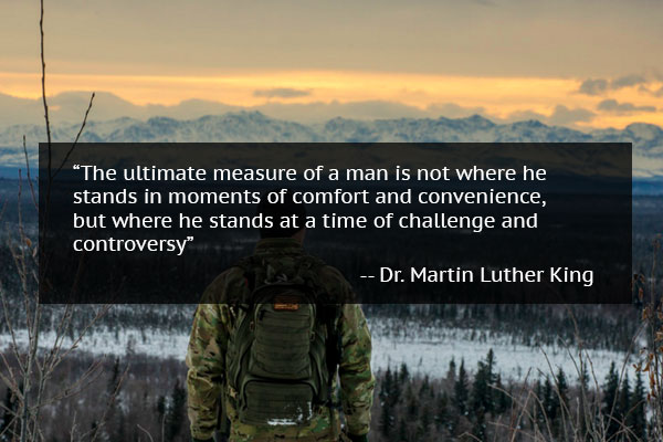 Man with backpack looking at the mountains with mindset quote from Dr. Martin Luther King
