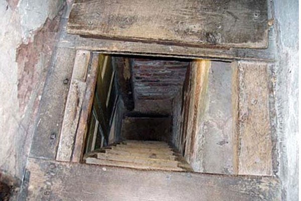 Opened shelter with stairs leading into the floor