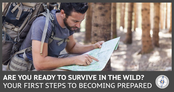 man in the woods with a backpack reading a map