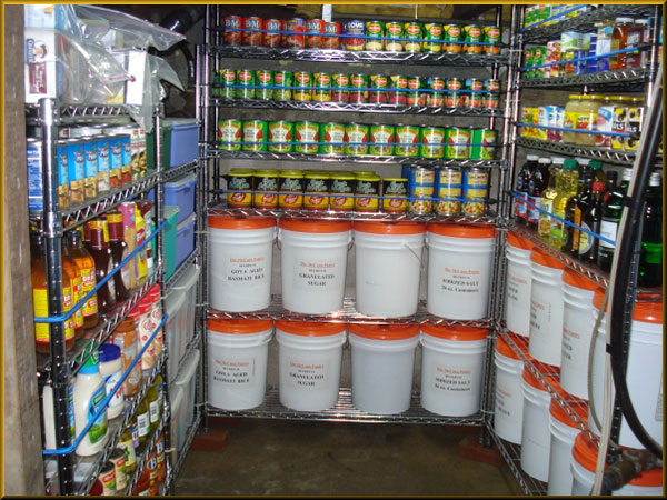 Pantry shelves with 5 gallon food buckets, canned food, and condiments