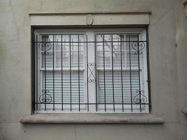 White window with black bars in front of it