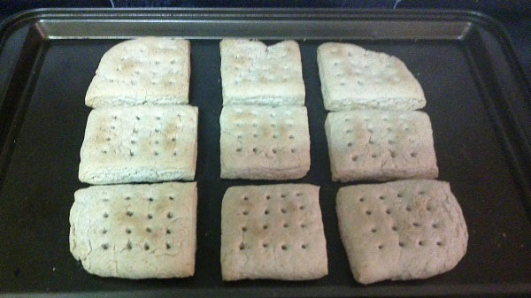 Hardtack cooking on a metal sheet