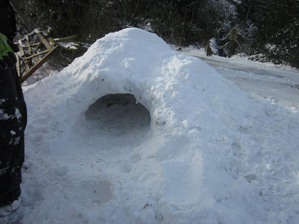 Snow cave alongside a road