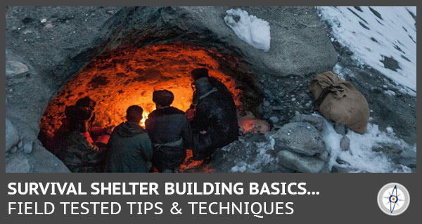 hikers huddling up together in a cave on a snow covered mountain side