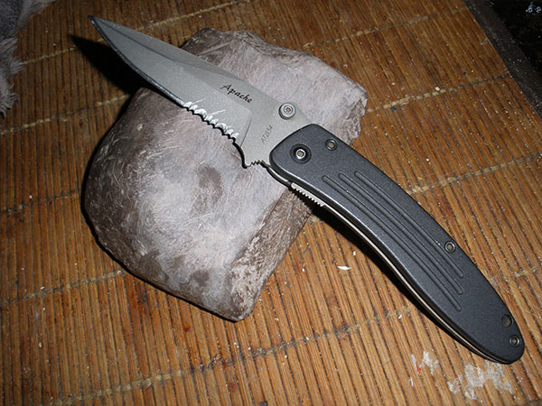Knife leaning against a rock