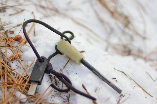 Ferro rod laying in the snow