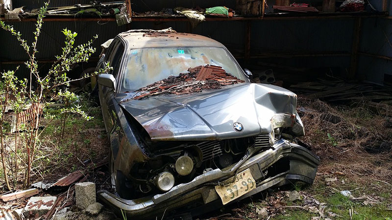 Old abandoned smashed car