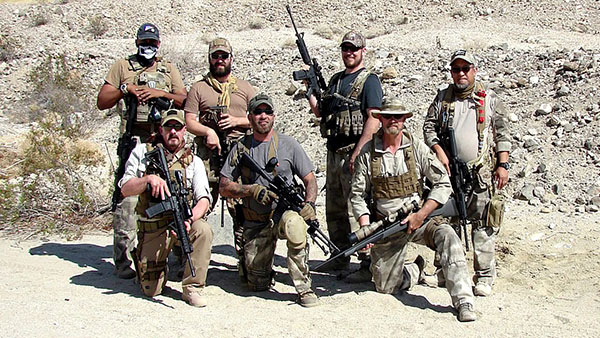 group of men posing for a picture dressed as a security force