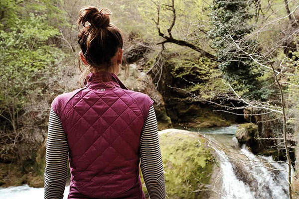 Hiking by waterfall